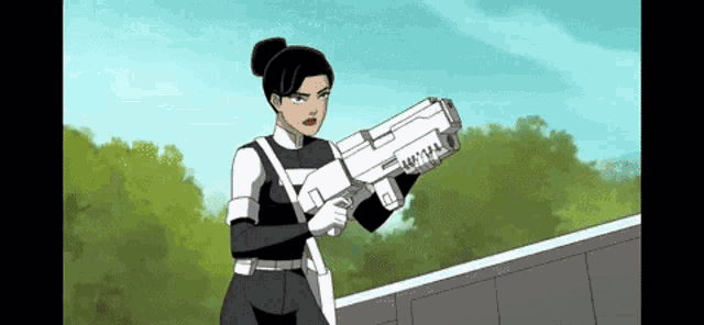 a woman in a black and white uniform is holding a large gun .