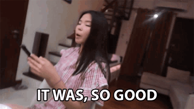 a woman says it was so good while holding her phone