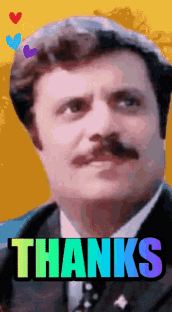 a man in a suit and tie says thanks in a rainbow colored font
