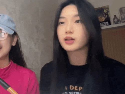 a girl wearing a black shirt that says a dep on it