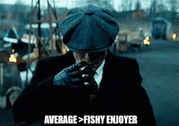 a man in a suit and hat is smoking a cigarette and saying average > fishy enjoyer .
