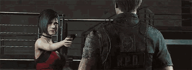 a man and a woman are standing next to each other in a boxing ring .