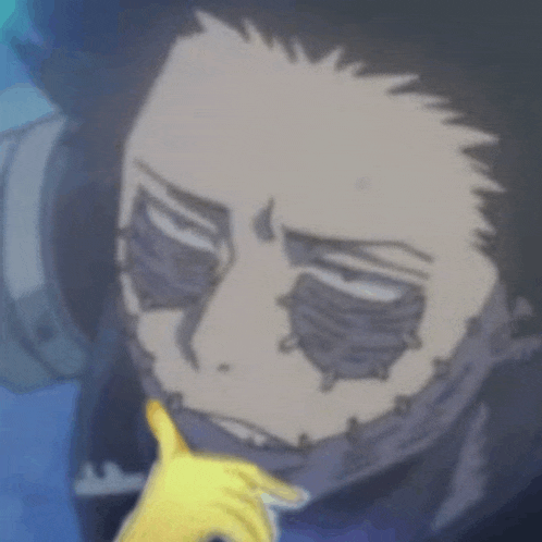 a close up of a cartoon character 's face with a yellow glove on his hand .
