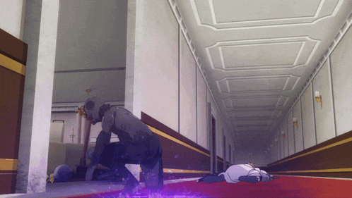 a person laying on the floor in a hallway with a purple light