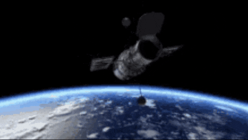a satellite is flying over the earth in the night sky