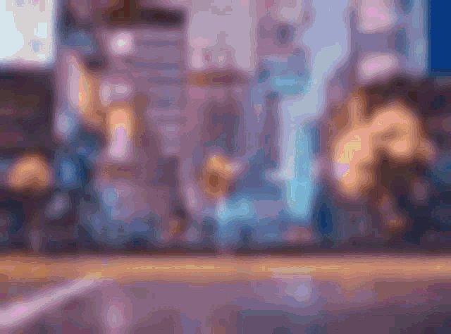 a blurry picture of a city at night with a purple and blue background