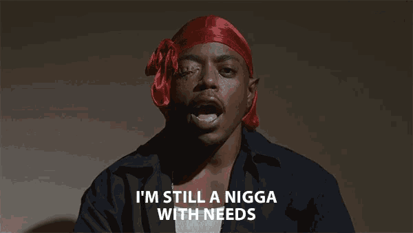 a man in a red headband says i 'm still a nigga with needs