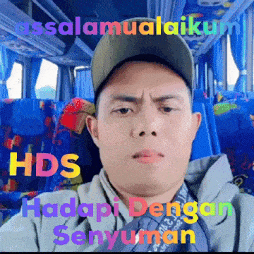 a man sitting in a bus with the words hds hadapi dengan senyuman written on his face