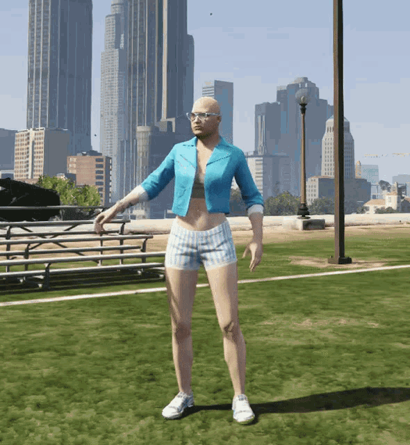 a bald woman wearing shorts and a blue jacket is standing in a field