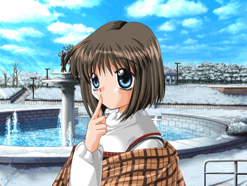 a girl covering her mouth with her finger in front of a fountain in the snow