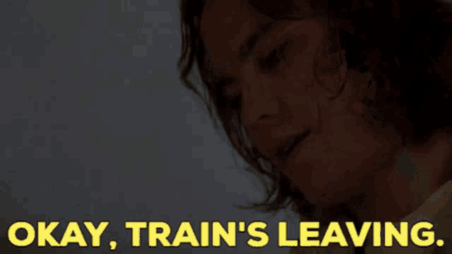 a close up of a man 's face with the words okay train 's leaving below him