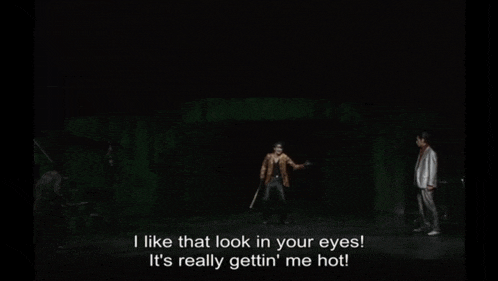 a man is holding a baseball bat and saying i like that look in your eyes