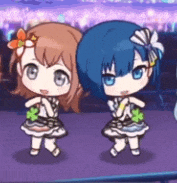 two little girls are dancing together in a video game .