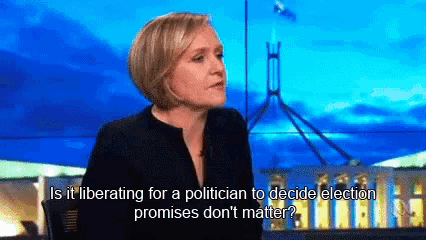 a woman is sitting in front of a screen that says is it liberating for a politician to decide election promises
