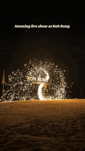 a fire show at koh rong cambodia is displayed at night