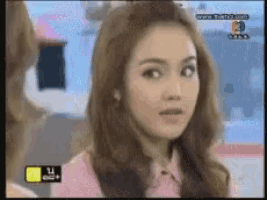 a close up of a woman 's face on a tv screen