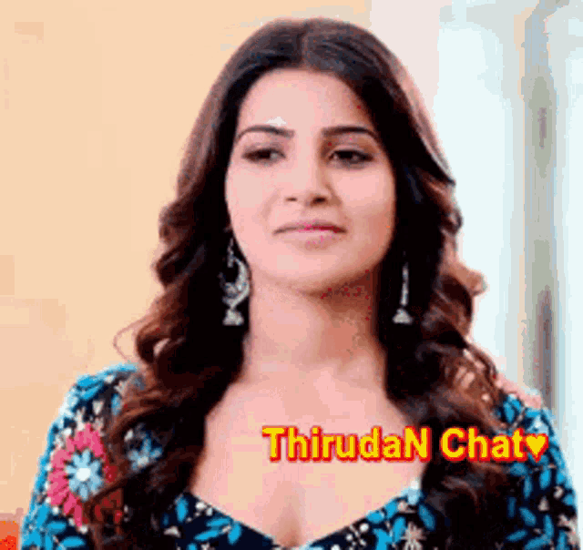a close up of a woman 's face with the words thiruda n chat on the bottom