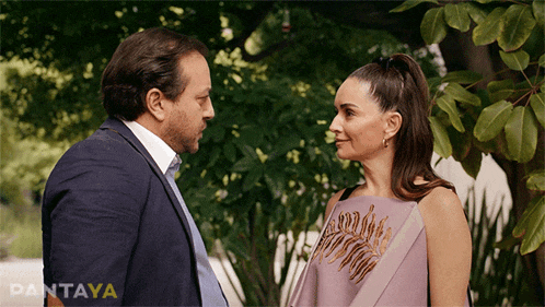 a man and a woman are standing next to each other and the word pantaya is on the bottom