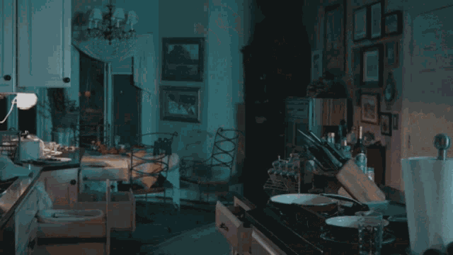 a ghost appears in a kitchen behind a paper towel