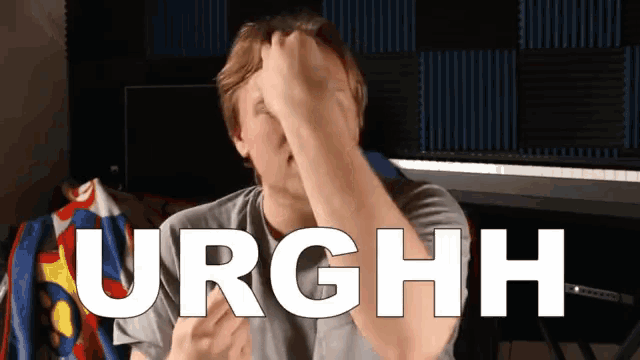 a man covering his face with his hand with the word urghh written in white