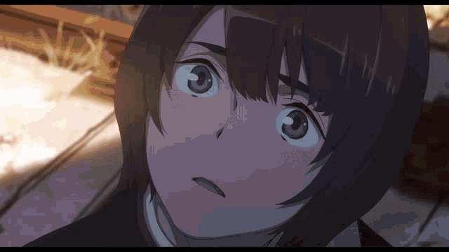 a close up of a girl 's face with a surprised expression