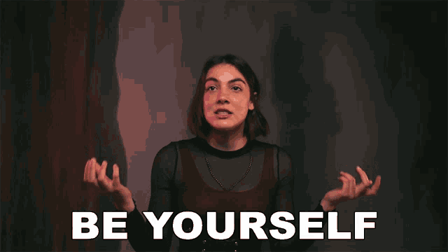 a woman making a funny face in front of the words be yourself