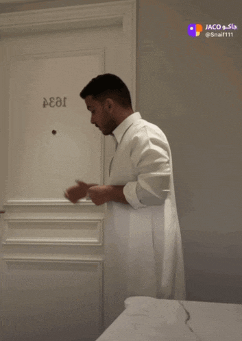 a man is standing in front of a door that says 1833