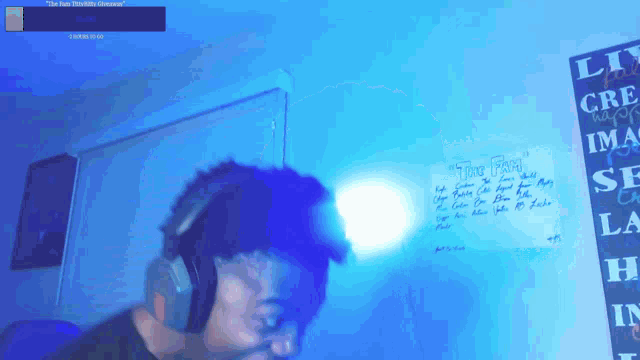 a man wearing headphones stands in front of a sign that says " time plan " on it