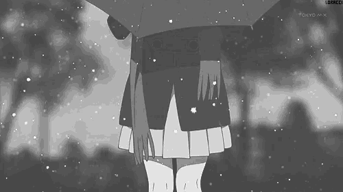 a girl is holding an umbrella in the snow in a black and white photo .