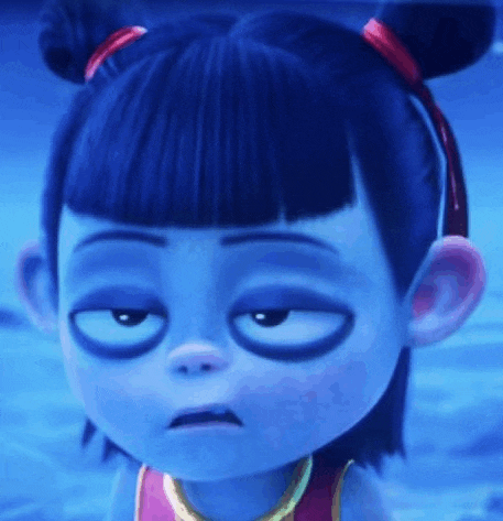 a close up of a cartoon girl with blue hair and black eyes making a funny face .