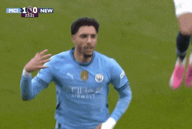 a soccer player wearing a blue etihad airways shirt