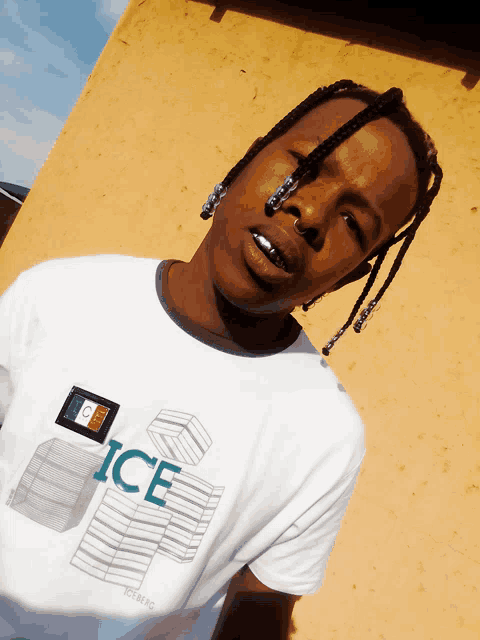 a man wearing a white t-shirt that says ice