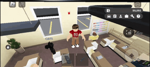 a boy in a red shirt that says rock n roll stands in a room