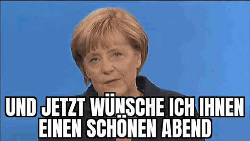 a woman with red hair is sitting in front of a blue background with the words und jetzt wünsche ich einen einen schönen abend