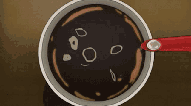 a cartoon drawing of a bowl of soup with a red spoon in it