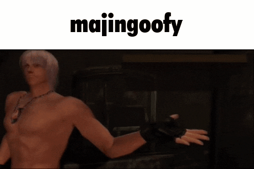 a shirtless man is holding a pizza box with majingoofy written on the bottom