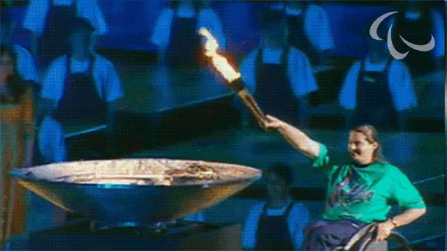 Lighting The Torch Paralympic Games GIF - Lighting The Torch Paralympic Games Start The Olympic Games GIFs