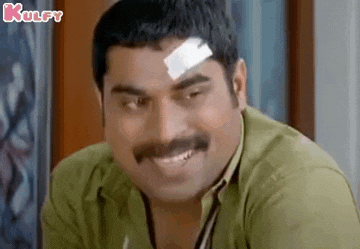 a man with a bandage on his forehead is smiling and making a funny face .