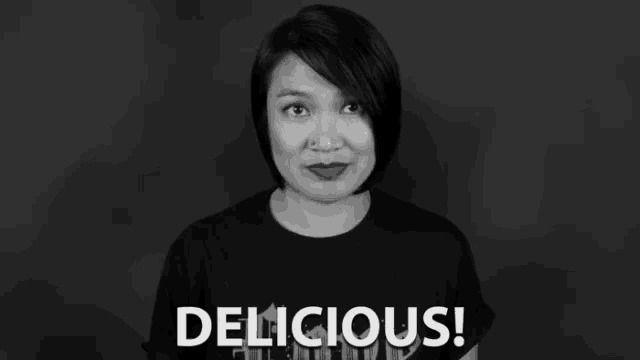 a woman in a black t-shirt says delicious