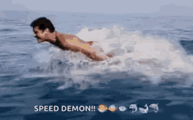 a man is swimming in the ocean with the words speed demon written below him
