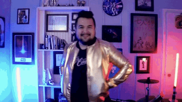 a man in a gold jacket is standing in a room with a clock on the wall