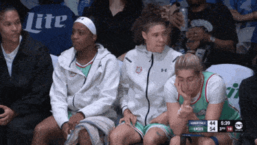 a basketball game is being played and the score is 54 to 54