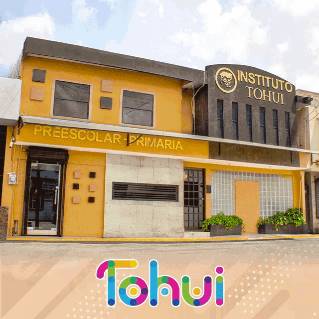 a yellow building with instituto tohui written on the top of it