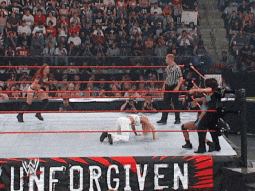 a wrestling ring with a banner that says w unforgiven