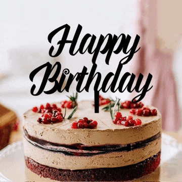 a birthday cake with a happy birthday cake topper