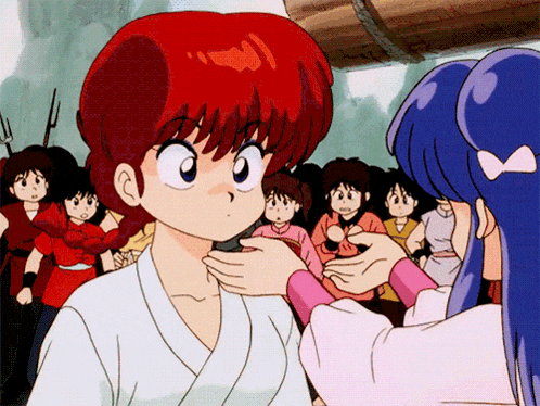 a girl with red hair is getting her hair done by another girl