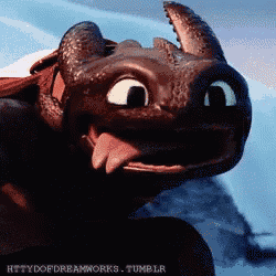 toothless from how to train your dragon is sticking out his tongue .