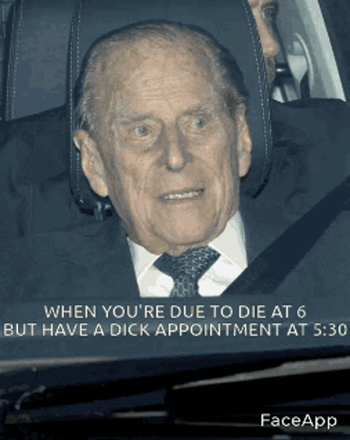 a man in a suit and tie is sitting in the back seat of a car with a caption that says faceapp