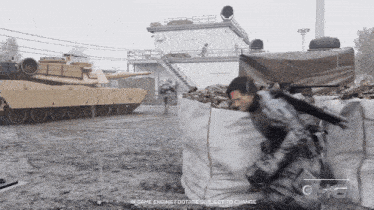 a man in a military uniform stands in front of a tank with the words " in game engine footage select to change " on the bottom