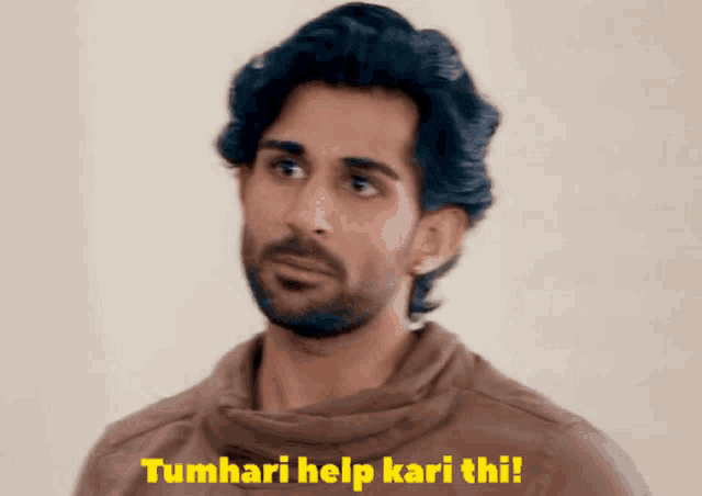 a man with a beard says tumhari help kari thi !